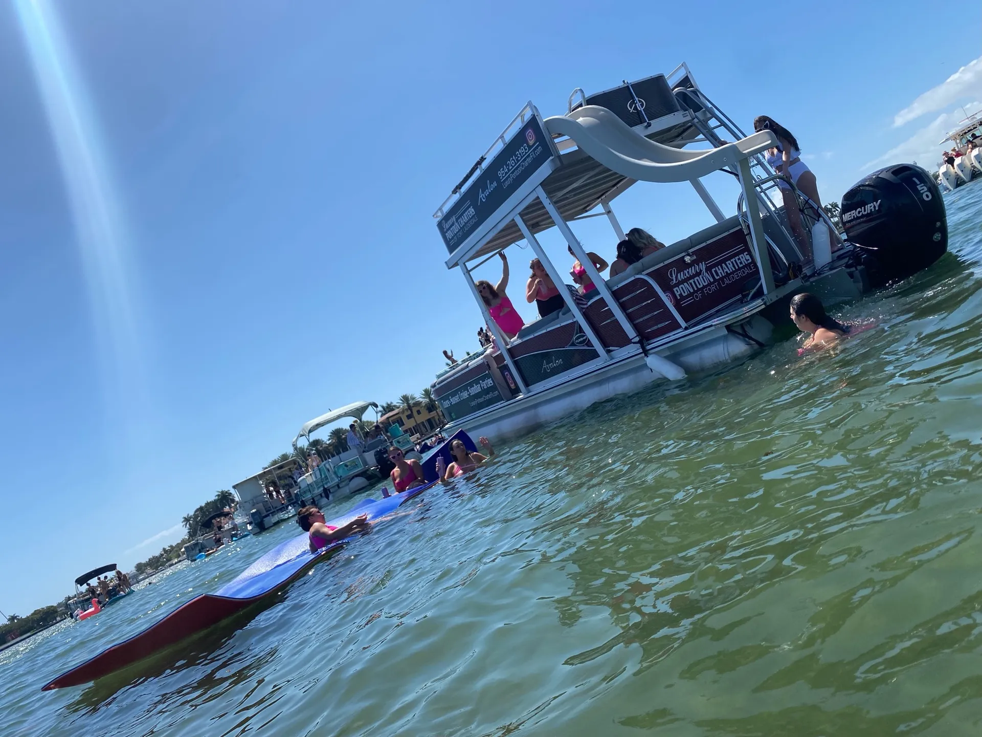 Avalon Funship pontoon for charter in Fort Lauderdale! Water slide