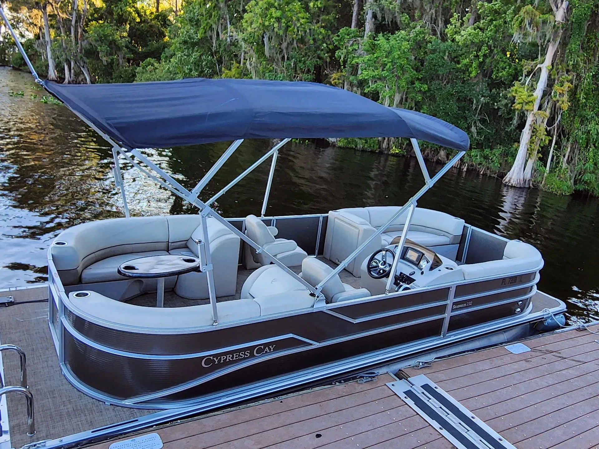 23ft Cypress Tritoon 12pp capacity 150hp with tubing included.