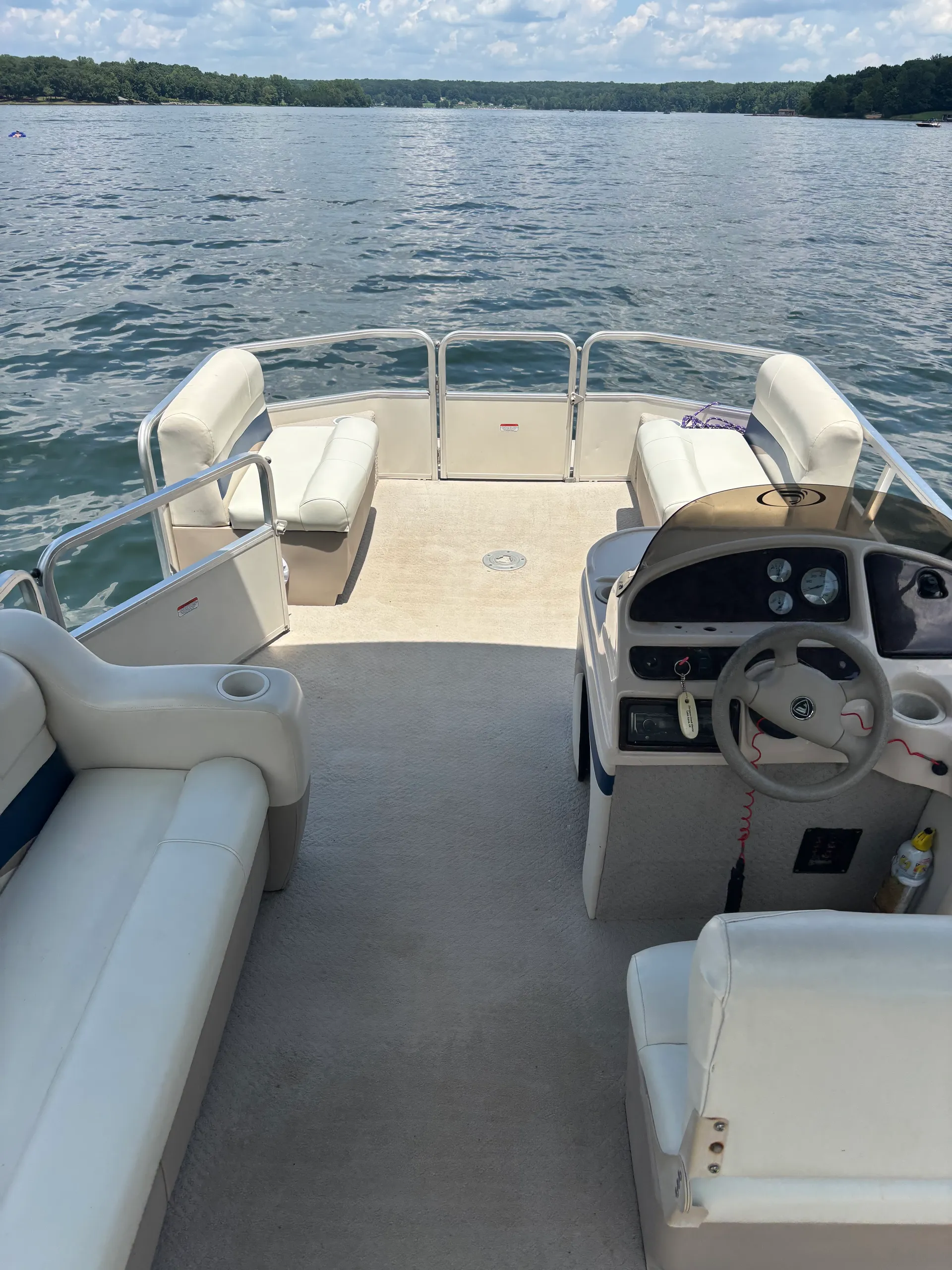 Fisher pontoon equipped for a day on the lake