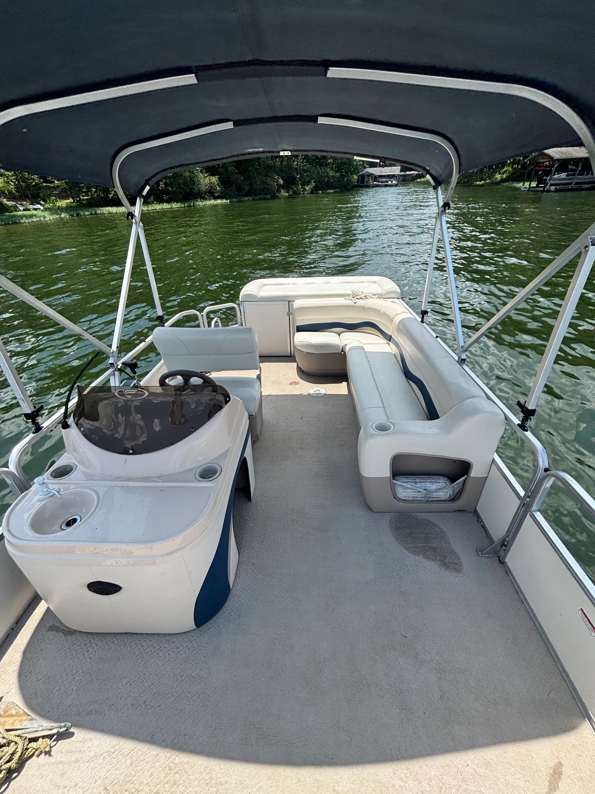 Fisher pontoon equipped for a day on the lake
