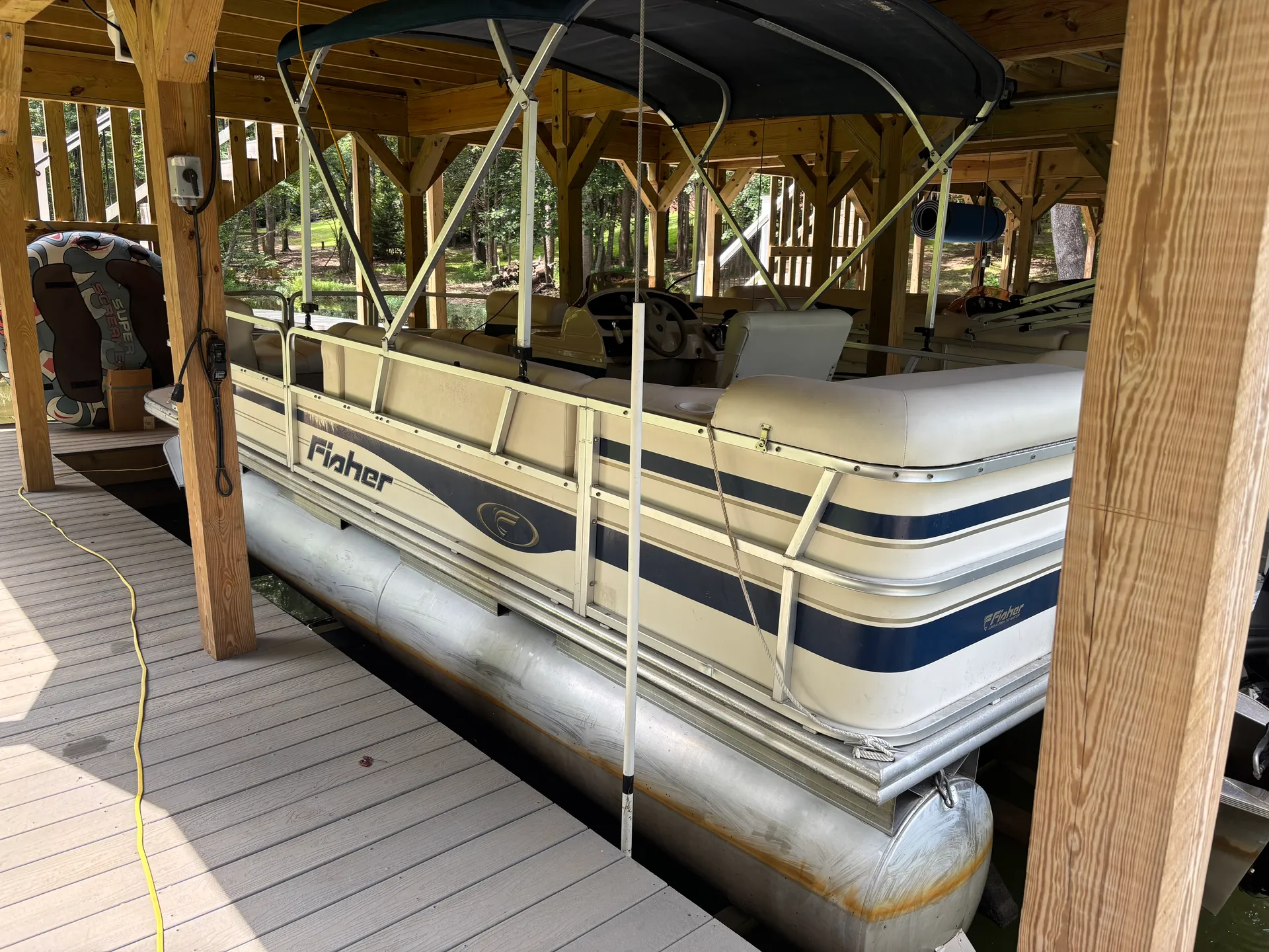 Fisher pontoon equipped for a day on the lake